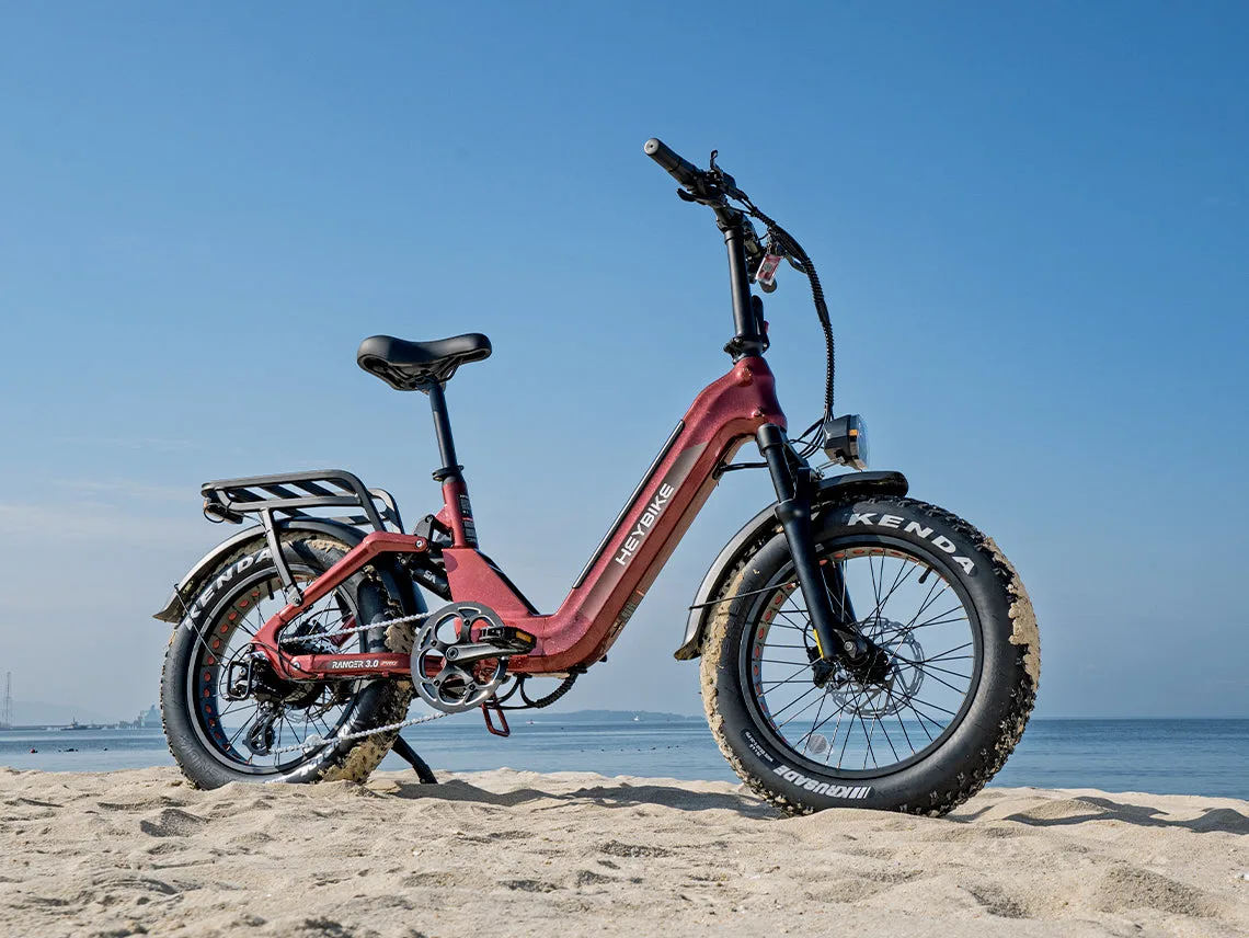 Heybike Ranger 3.0 Pro on a beach, shown in red